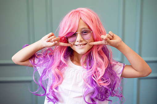Vanilla Girl. Kawaii vibes.  Candy colors design. little girl with pink hair and sun glasses smile and has a fun