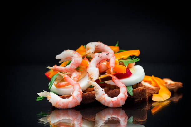 istock cooked sandwich with shrimp, eggs, pepper and greens 1769261887