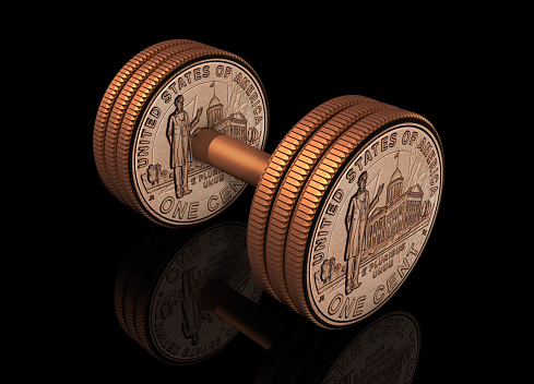 Dumbbell shaped US cent coins on black background. / You can see the animation movie of this image from my iStock video portfolio. Video number: 1765480989