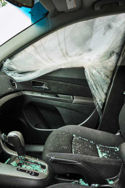 istock Shattered car window covered in plastic after a break in 1769283340