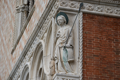 Architectural details of the facade of Doge's Palace, one of the main Venetian landmarks. Venice - 5 May, 2019