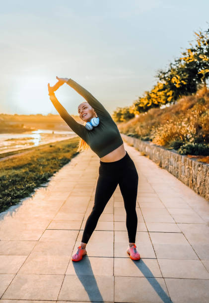istock Woman stretching and exercising outdoor 1769306307
