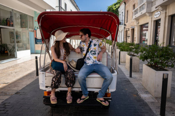 istock Tourist couple in rickshaw ride in historic district 1769310721