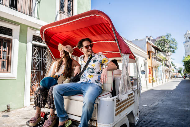 istock Tourist couple in rickshaw ride in historic district 1769310880
