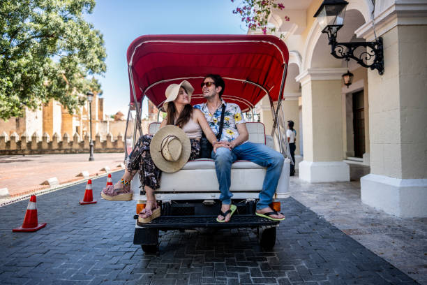 istock Tourist couple in rickshaw ride in historic district 1769310890