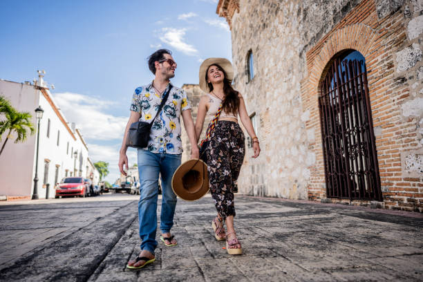 Tourist couple walking in historic district of Santo Domingo, Dominican Republic