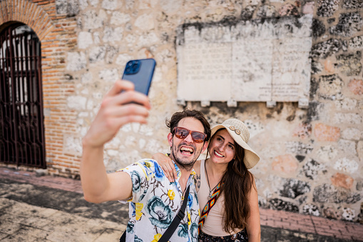 Tourist couple taking a selfie in Santo Domingo, Dominican Republic