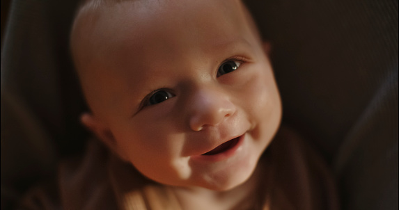Pure happiness from above,A directly above portrait of our cute baby boy,filled with laughter and joy,captured at home
