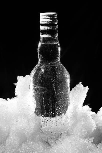 Close up view of the bottle in ice stock photo