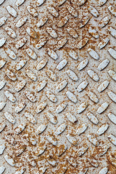 istock Rusted gray diamond metal plate background texture 176934280