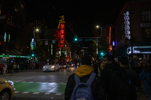 Vancouver, CANADA - Oct 31 2023 : Image of people gathering on Granville Street at downtown to celebrate Halloween.