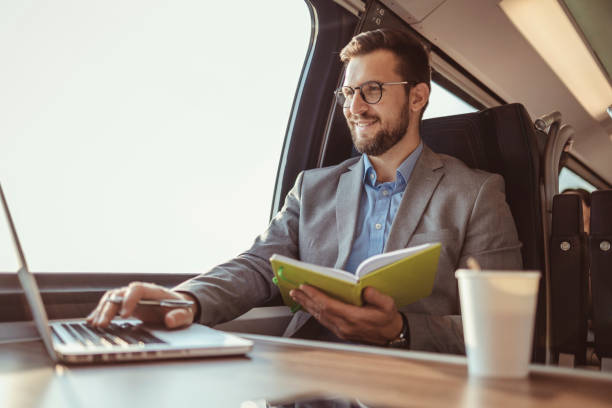istock Businessman With Notebook and Laptop While Traveling With High-speed Train 1769369459