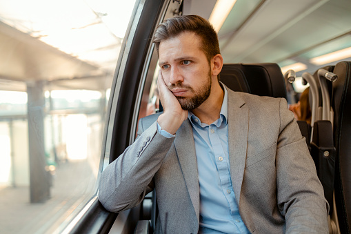 Anxious Man Commuting on Train