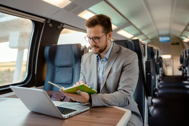istock Businessman With Notebook and Laptop While Traveling With High-speed Train 1769372342