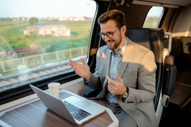 istock Business Commuter Holding Video Call With Clients on Laptop 1769373468