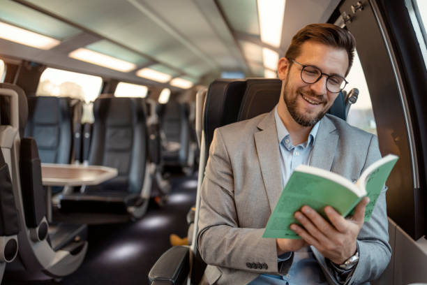 Commuter with Book Traveling With High-speed Train