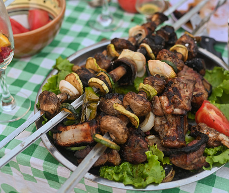 barbecue grilled meat with vegetables and mushrooms. grilled barbecue meat with vegetable.