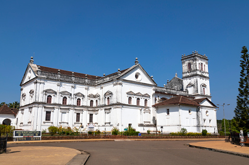 This image features the historic churches of Old Goa, a UNESCO World Heritage Site known for its well-preserved examples of religious architecture dating back to the Portuguese colonial era. The churches, such as the Basilica of Bom Jesus and the Se Cathedral, stand as majestic landmarks with intricate facades, large courtyards, and imposing towers. The photograph aims to capture the grandeur and architectural finesse of these religious edifices, while also shedding light on their historical significance. Through the lens, viewers get a sense of both the spiritual and cultural importance these churches hold, serving as both tourist attractions and places of worship that have stood the test of time.