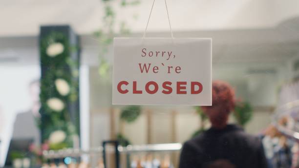 istock Worker closing down clothing shop 1769401955