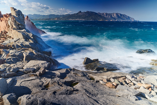 Coastal red rock formation called Rocce Rosse in Arbatax. Tortoli municipality. Province of Nuoro. Sardinia. Italy.