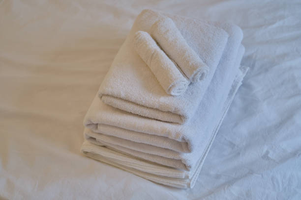 istock A stack of clean white towels on the bed. Hotel service. Place for text 1769412165