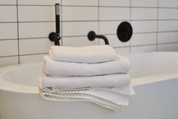 istock A stack of clean white towels on the bed. Hotel service. Place for text 1769412684