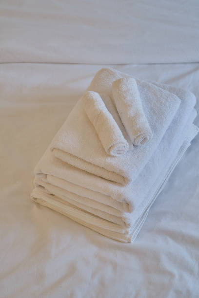istock A stack of clean white towels on the bed. Hotel service. Place for text 1769412694