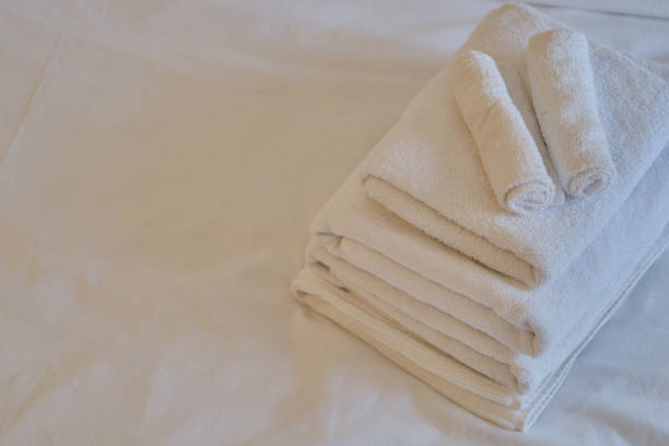 istock A stack of clean white towels on the bed. Hotel service. Place for text 1769413249