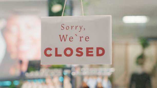 istock Closed sign on clothing store door 1769417509