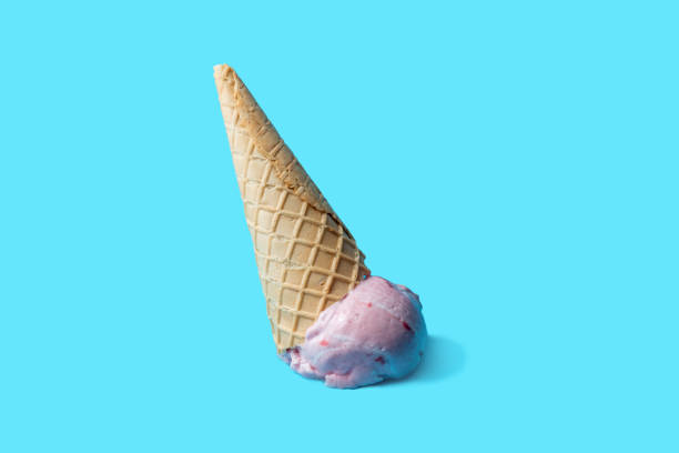 istock Pink ice cream fallen lies upside down on a blue background 1769440930