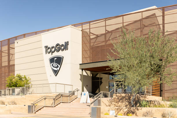TopGolf located in Scottsdale, AZ. Scottsdale, AZ, USA - October 25, 2023: TopGolf features multiple floors of driving range bays and is a fun entertainment complex for all ages to enjoy. southwest usa architecture building exterior scottsdale stock pictures, royalty-free photos & images