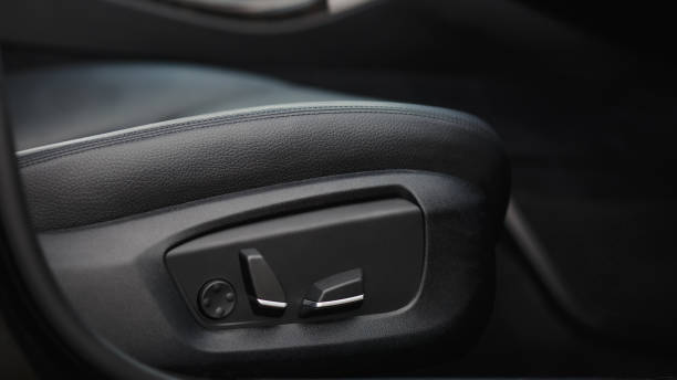 istock Car seat electronic switch button. lever for electronic seat adjustment in a modern premium car. Seat memory option. Close up of seat bottoms. 1769446831