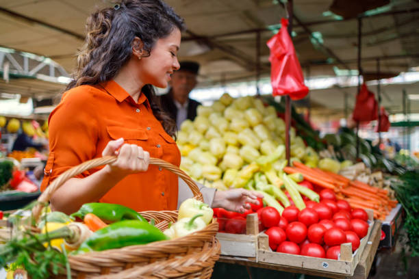 istock Woman explores vegetable aisle in market 1769453541