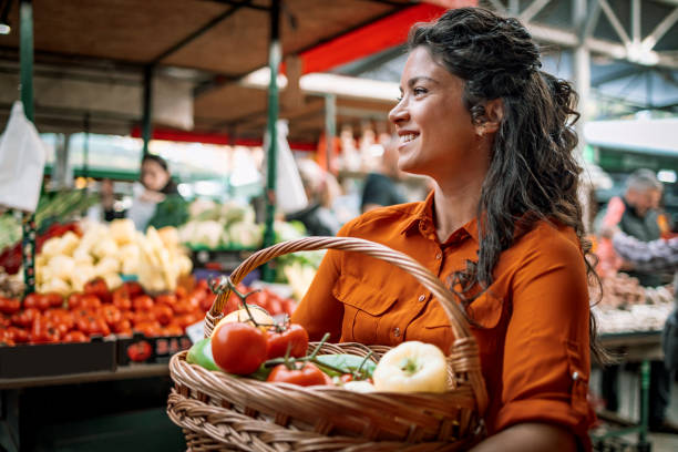 istock Shopper checks vegetable quality 1769453623