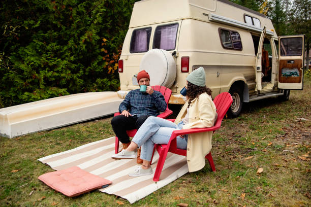 istock Millennial couple enjoying a week-end in vintage camper van. 1769455140