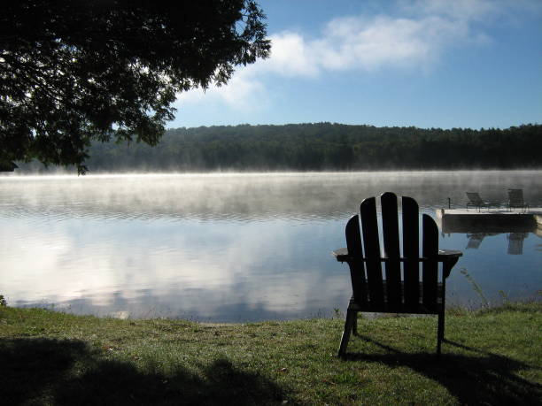 istock Adirondack Chair besides a Lake 1769458910