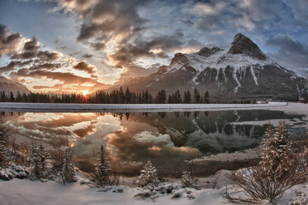 istock Sun rises above mountain lake, after snowfall 176946483