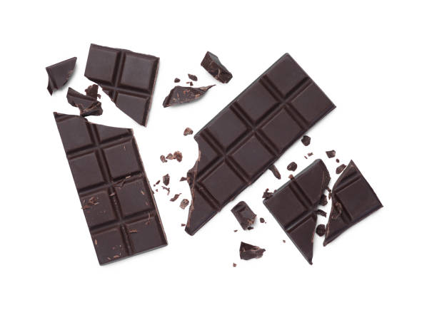 istock Delicious broken dark chocolate bars on white background, top view 1769464982