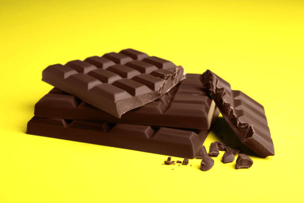 istock Delicious dark chocolate bars on yellow background 1769465033