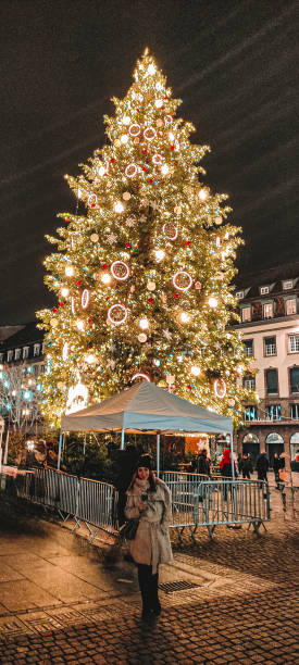 istock Woman in the Christmas tree 1769487375