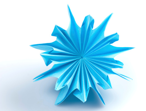 blue origami unit snowflake isolated on white background
