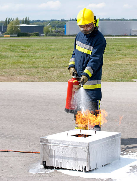 istock Fireman in full gear extinguishing fire outdoors 176951702