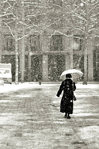 istock lone woman walking 176952343