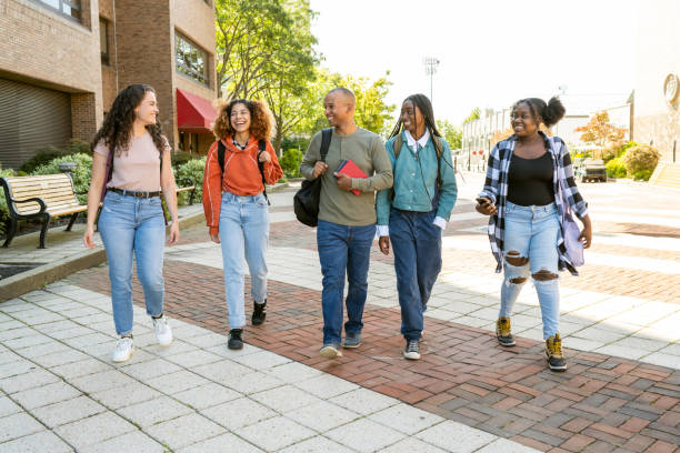 istock Group of diverse students arrive at University Campus 1769530284