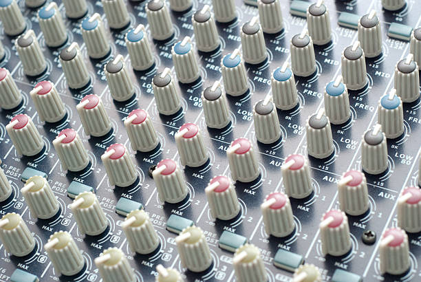 Mixing Desk With Round Switches DJ equipment to mix and fine tune music knurl stock pictures, royalty-free photos & images