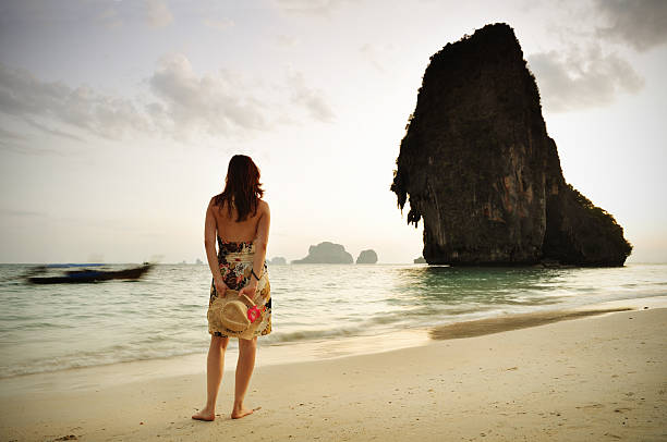 istock Woman standing at the beach 176953364