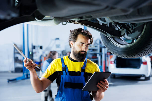 istock Employee checks vehicle with tablet 1769534576
