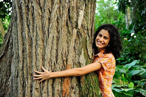 istock Woman hugging a tree in the forest 176953490
