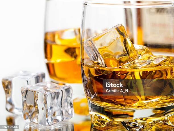Two Glasses Of Whiskey On The Rocks Stock Photo - Download Image Now - Alcohol - Drink, Blended Drink, Brown
