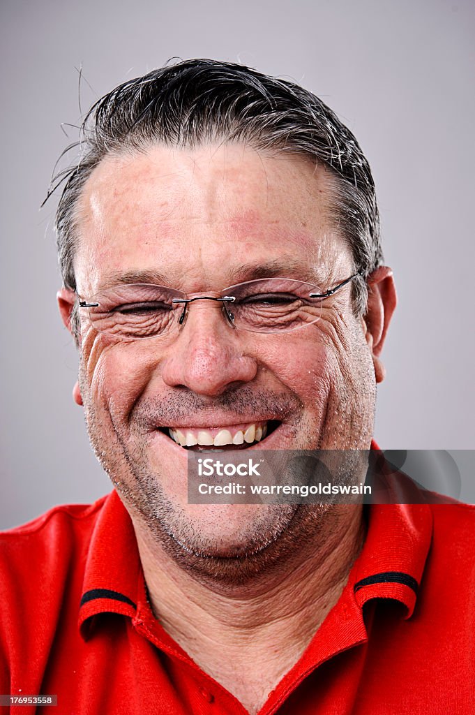Portrait of person with happy smile, with a grey background  Highly detailed fine art portrait. smiling happy real person 50-59 Years Stock Photo